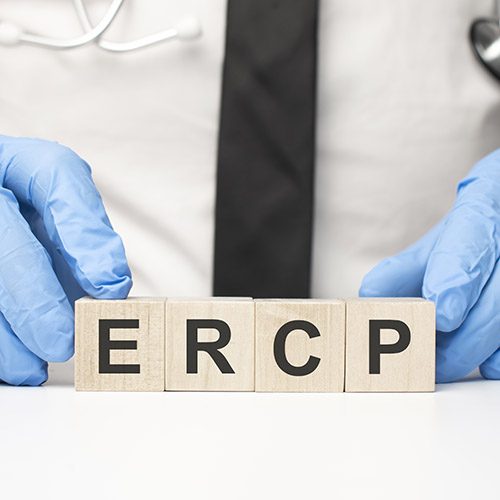 cubes with the word ercp on doctor's hand. Care concept.